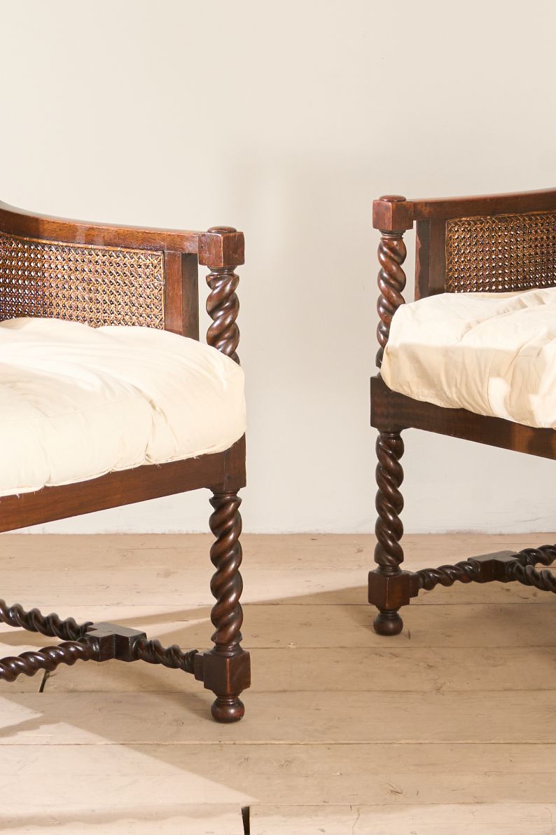 Pair of c.1920 barley twist mahogany rattan lounge chairs