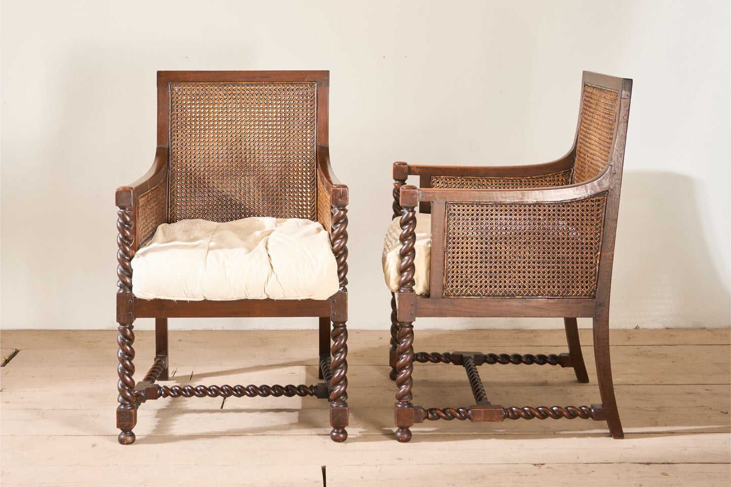 Pair of c.1920 barley twist mahogany rattan lounge chairs