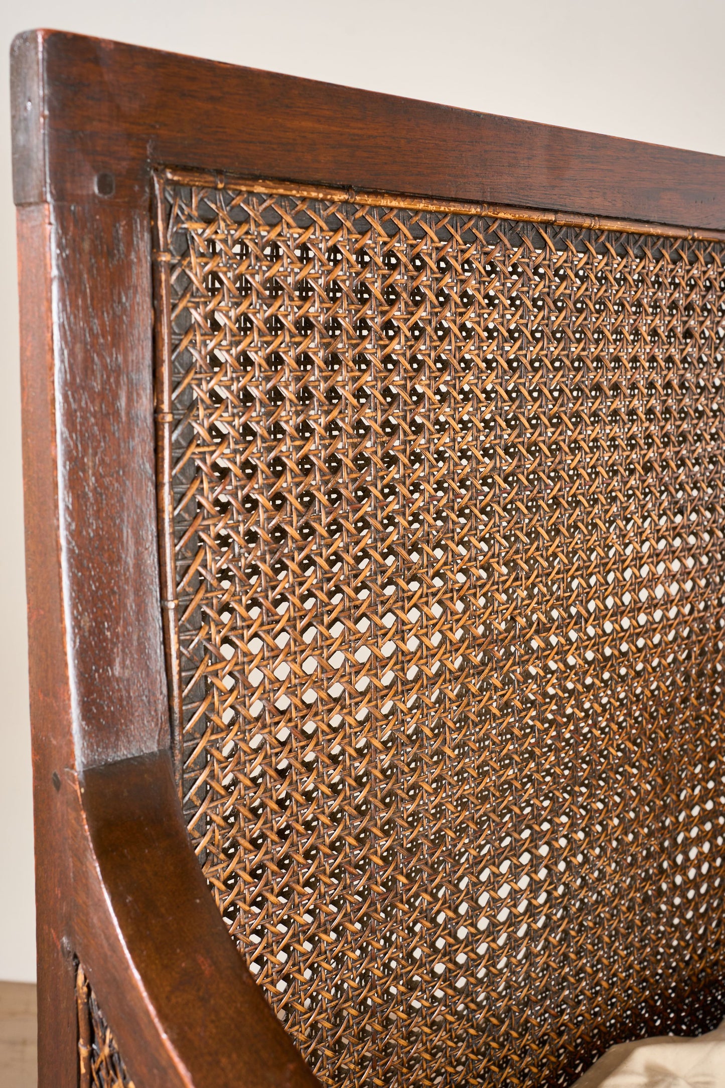 Pair of c.1920 barley twist mahogany rattan lounge chairs