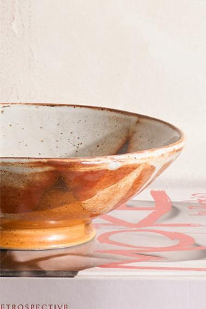 Vintage studio pottery bowl with orange decoration