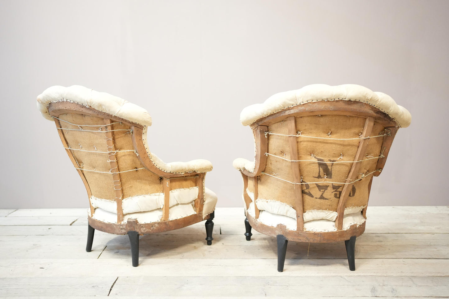Pair of Napoleon III buttoned fishtail armchairs