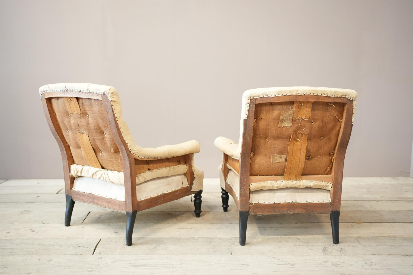 Pair of Napoleon III buttoned square back armchairs
