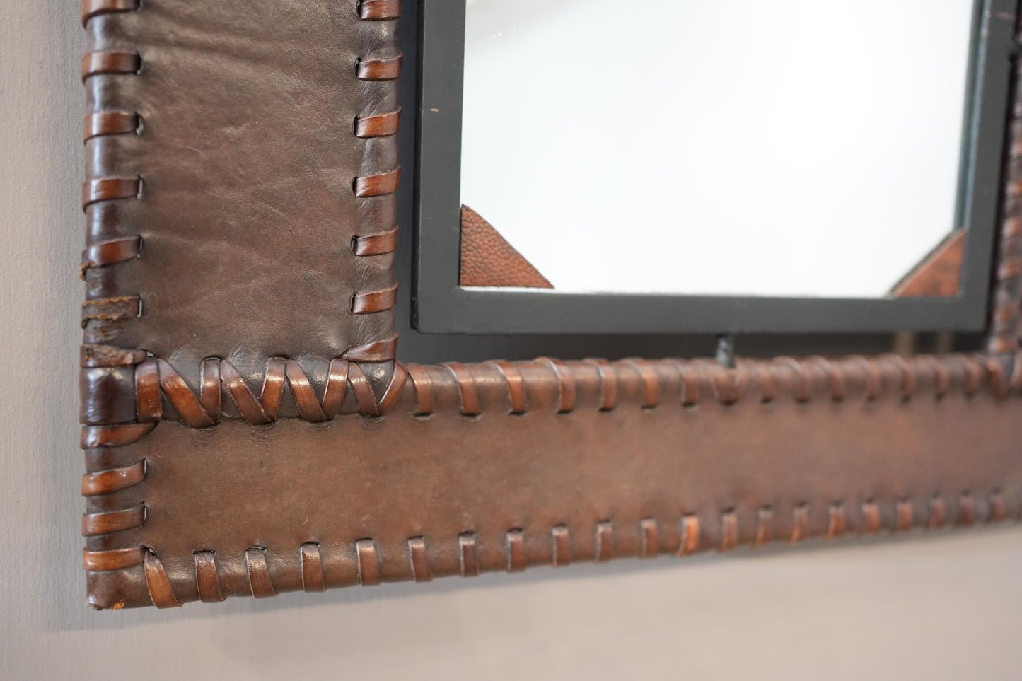 20th century Leather and iron wall mirror