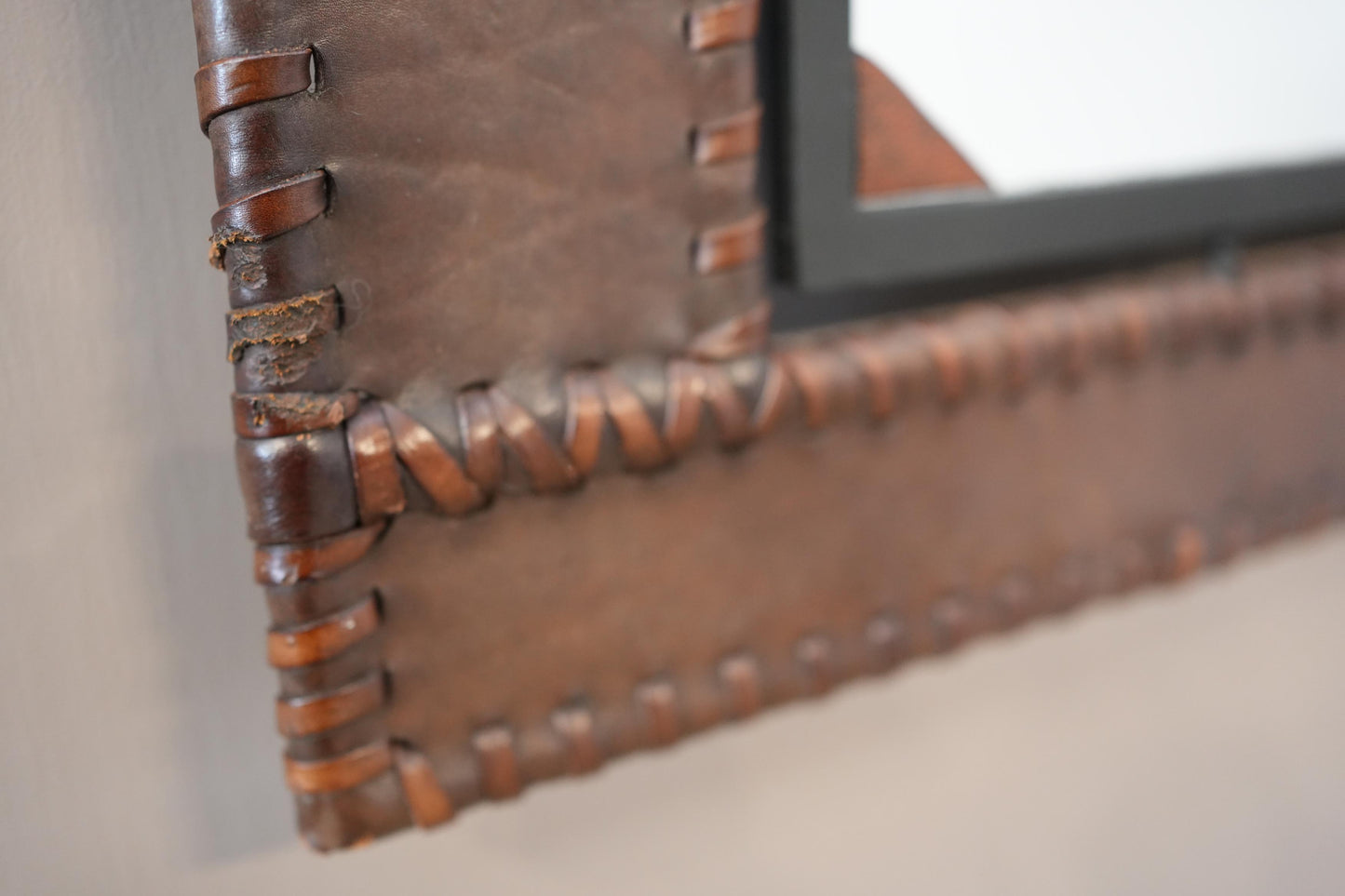 20th century Leather and iron wall mirror
