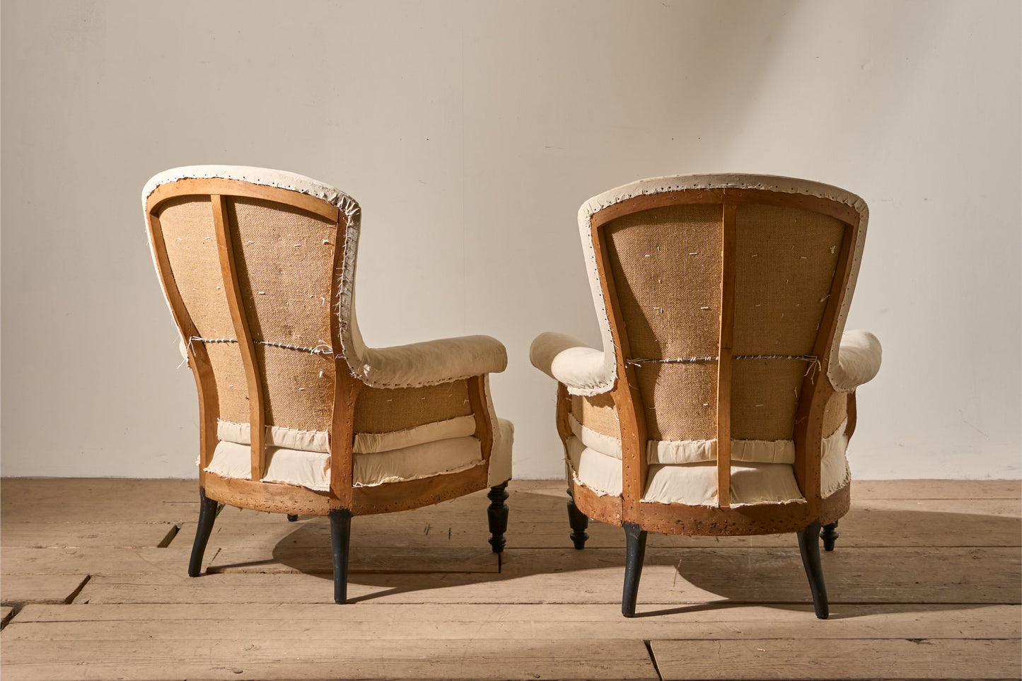 Pair of Napoleon III High backed plain armchairs
