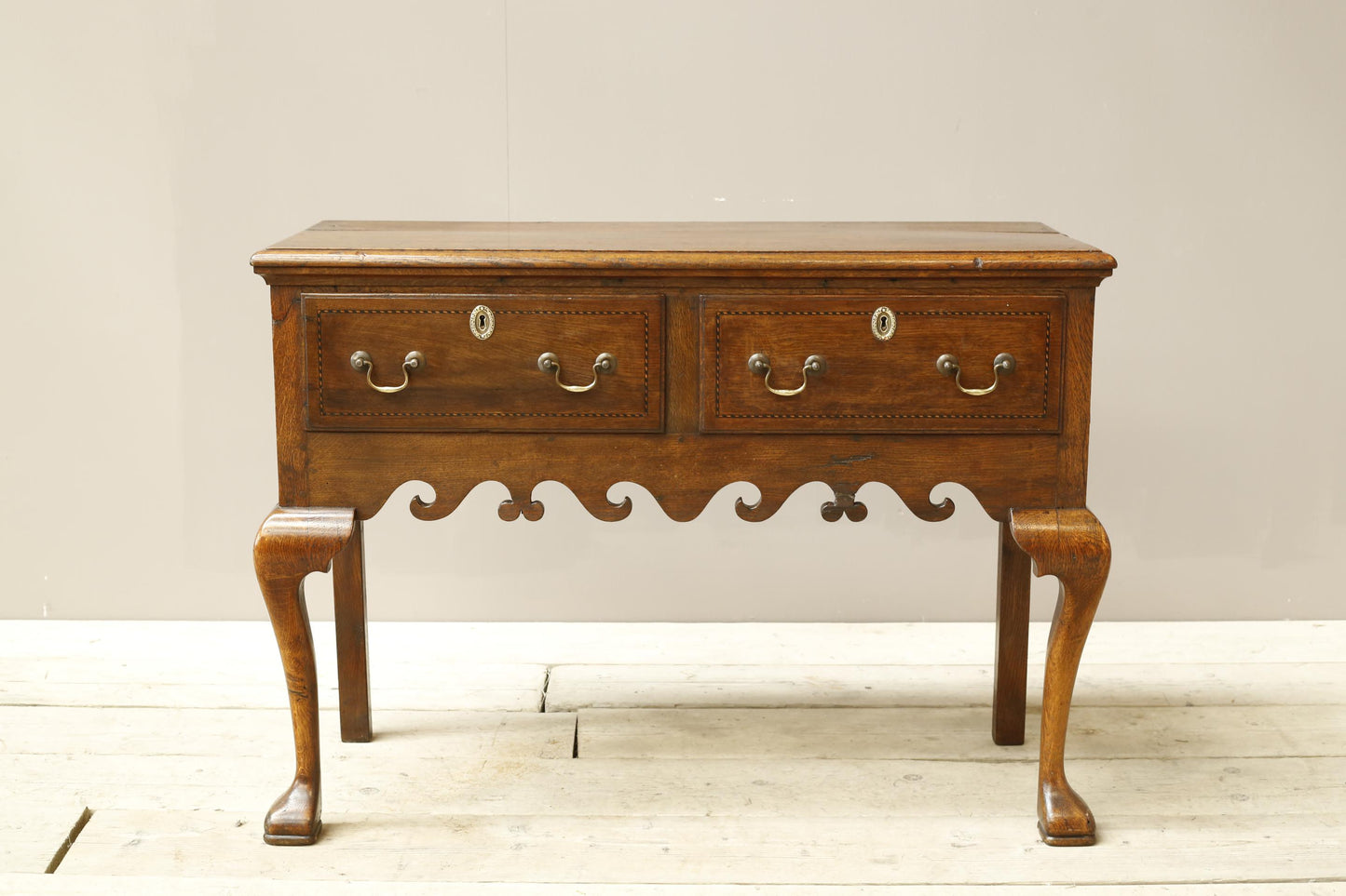 18th century Georgian lowboy with fret work boarder