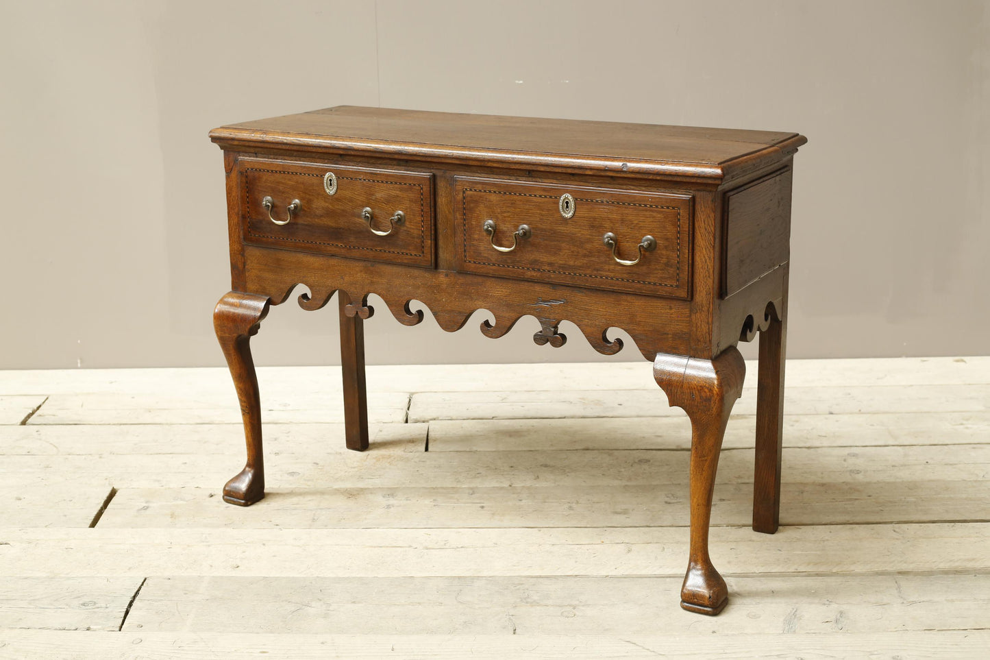 18th century Georgian lowboy with fret work boarder