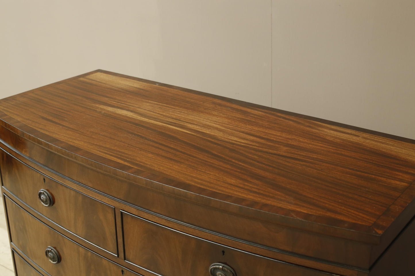 Edwardian flame mahogany chest of drawers by Marsh, Jones & Cribb