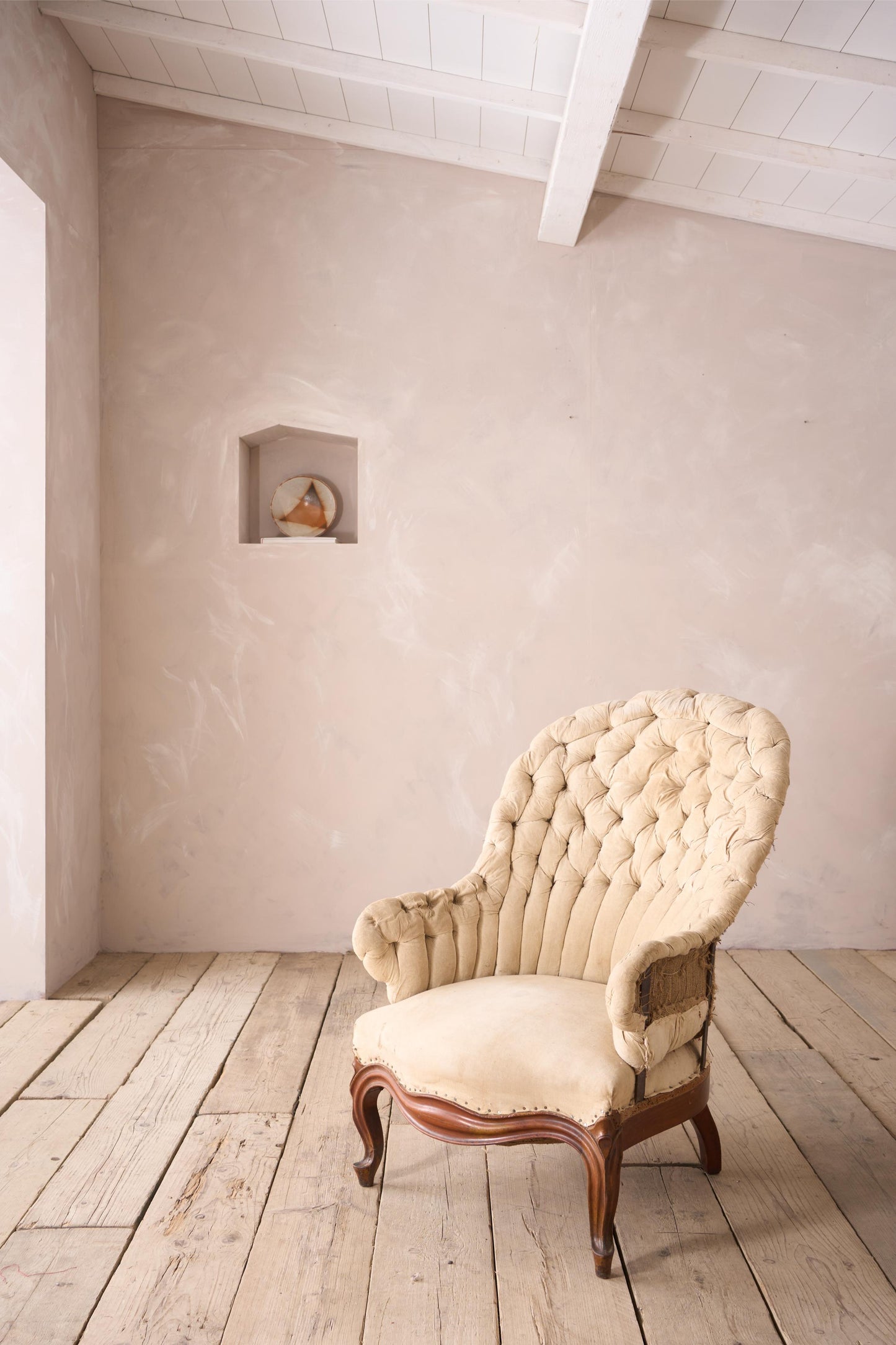 19th century French buttoned iron back armchair