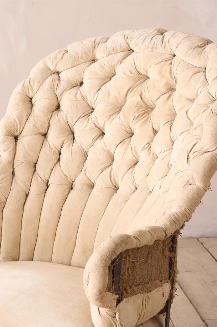 19th century French buttoned iron back armchair