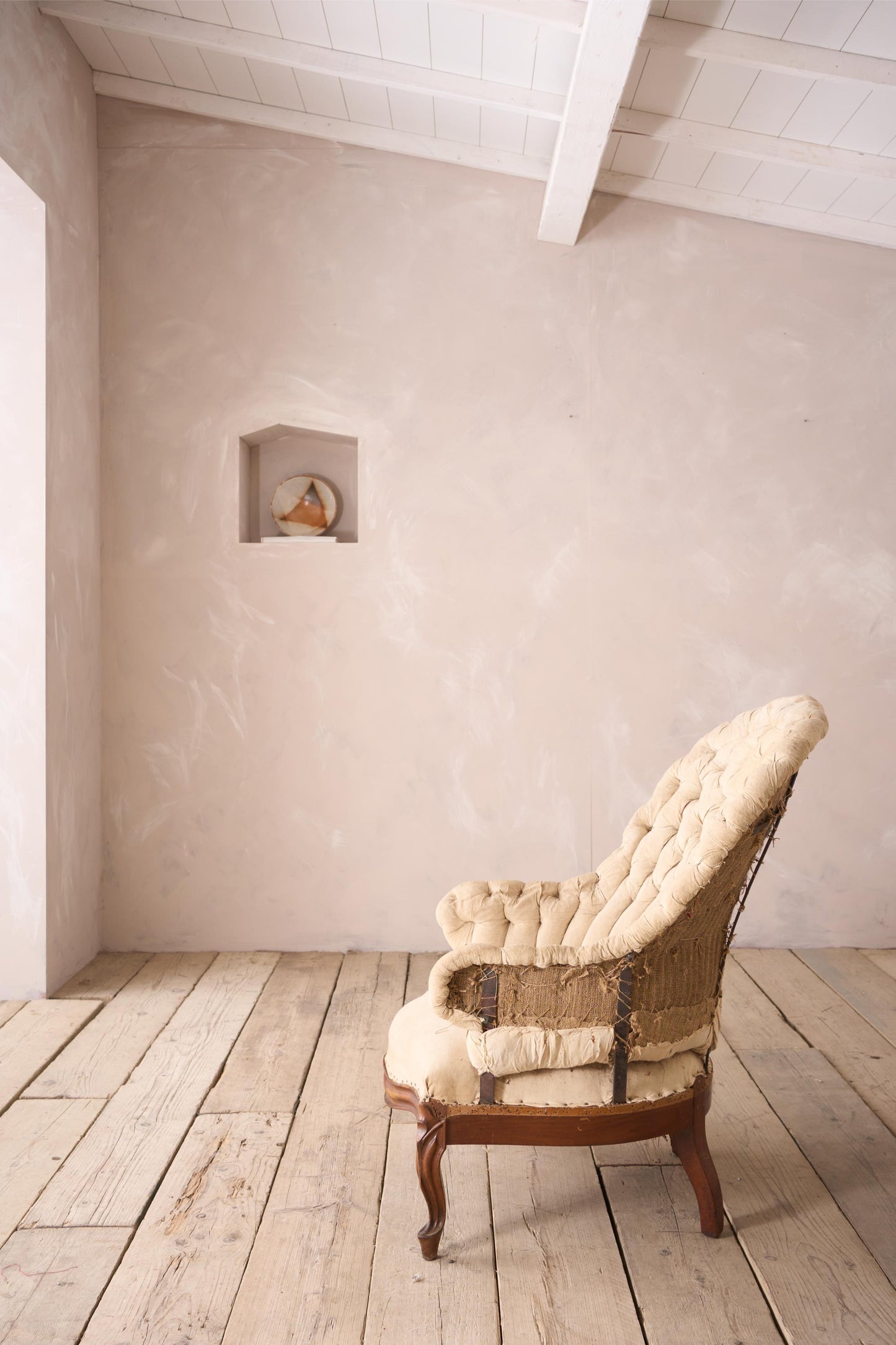 19th century French buttoned iron back armchair