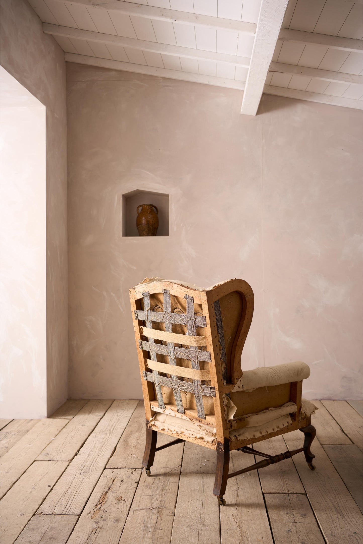 Victorian stretchered wingback armchair by John Reid & Sons