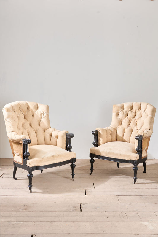 Pair of Napoleon III large buttoned shield back armchairs