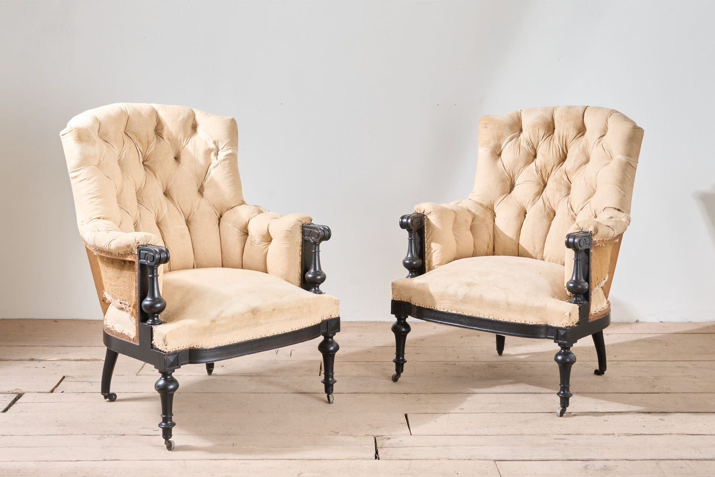 Pair of Napoleon III large buttoned shield back armchairs