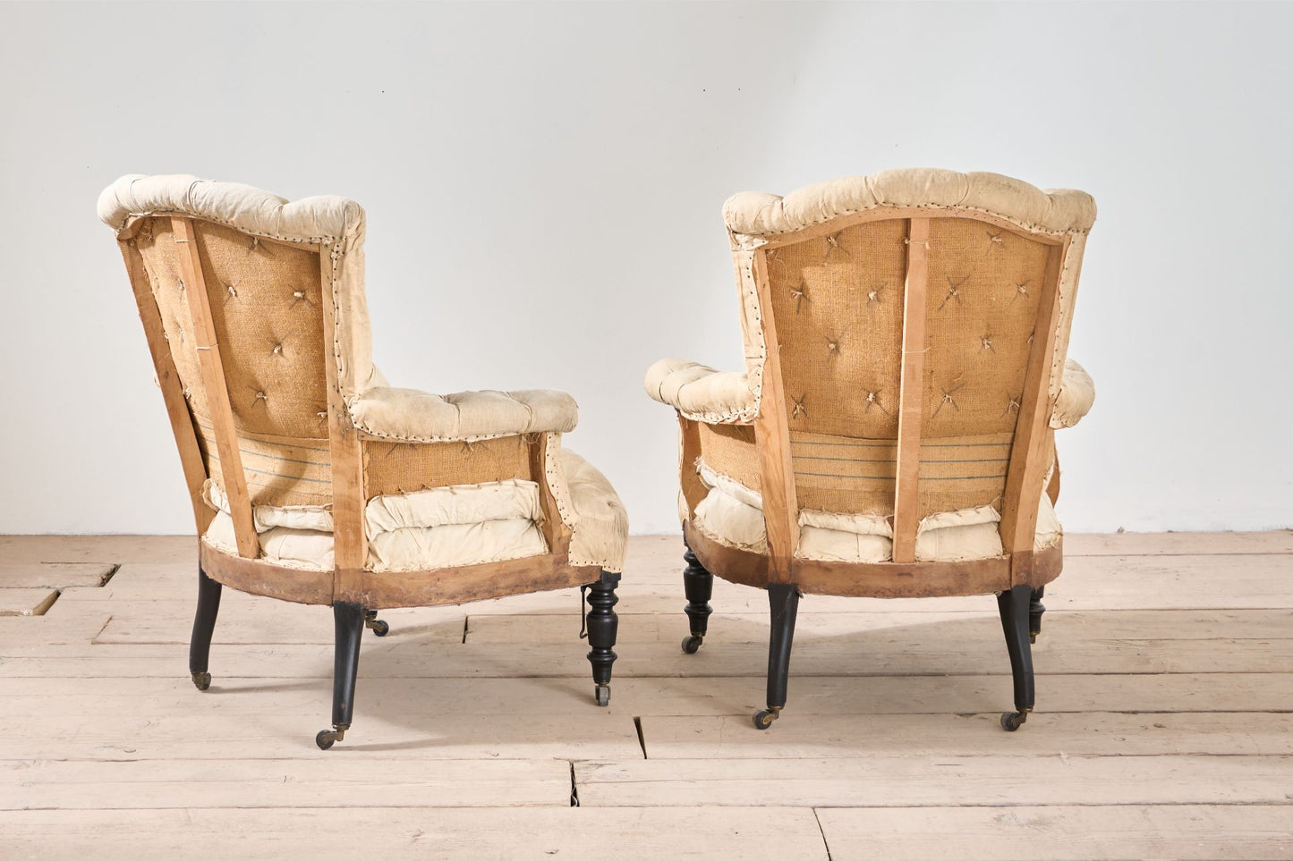 Rare Napoleon III pair of Buttoned back and seat armchairs with matching stool