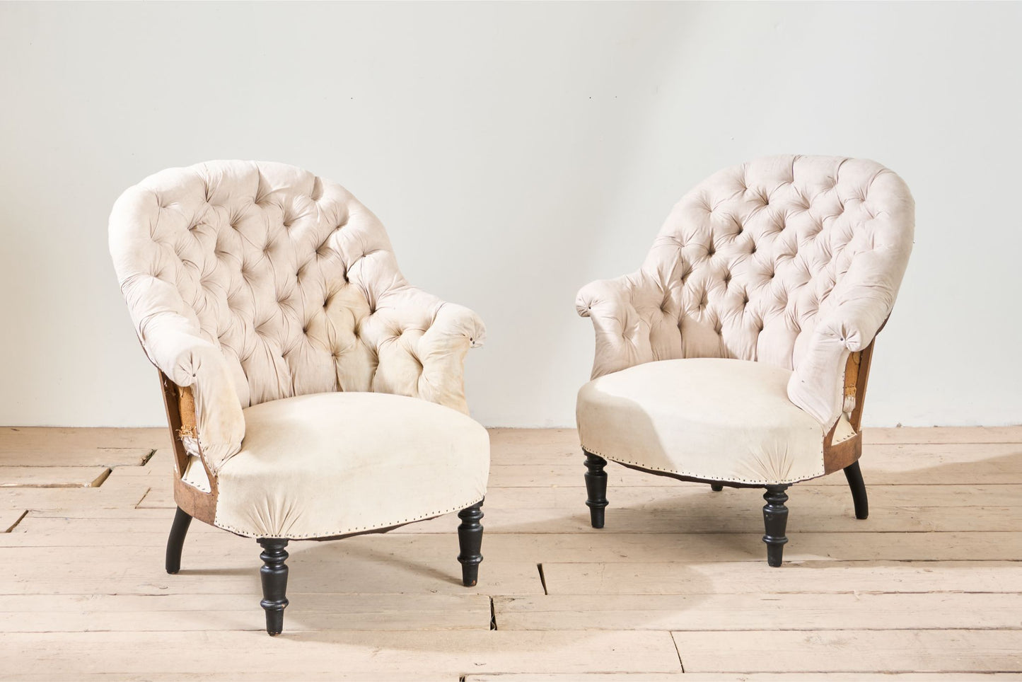 Pair of Napoleon III buttoned tub chairs