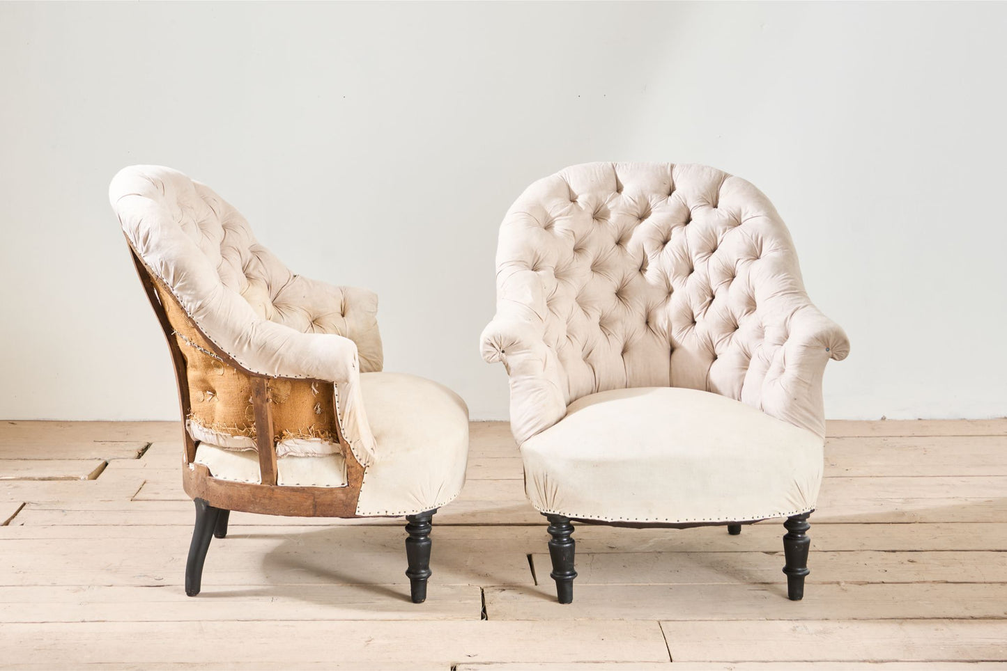 Pair of Napoleon III buttoned tub chairs
