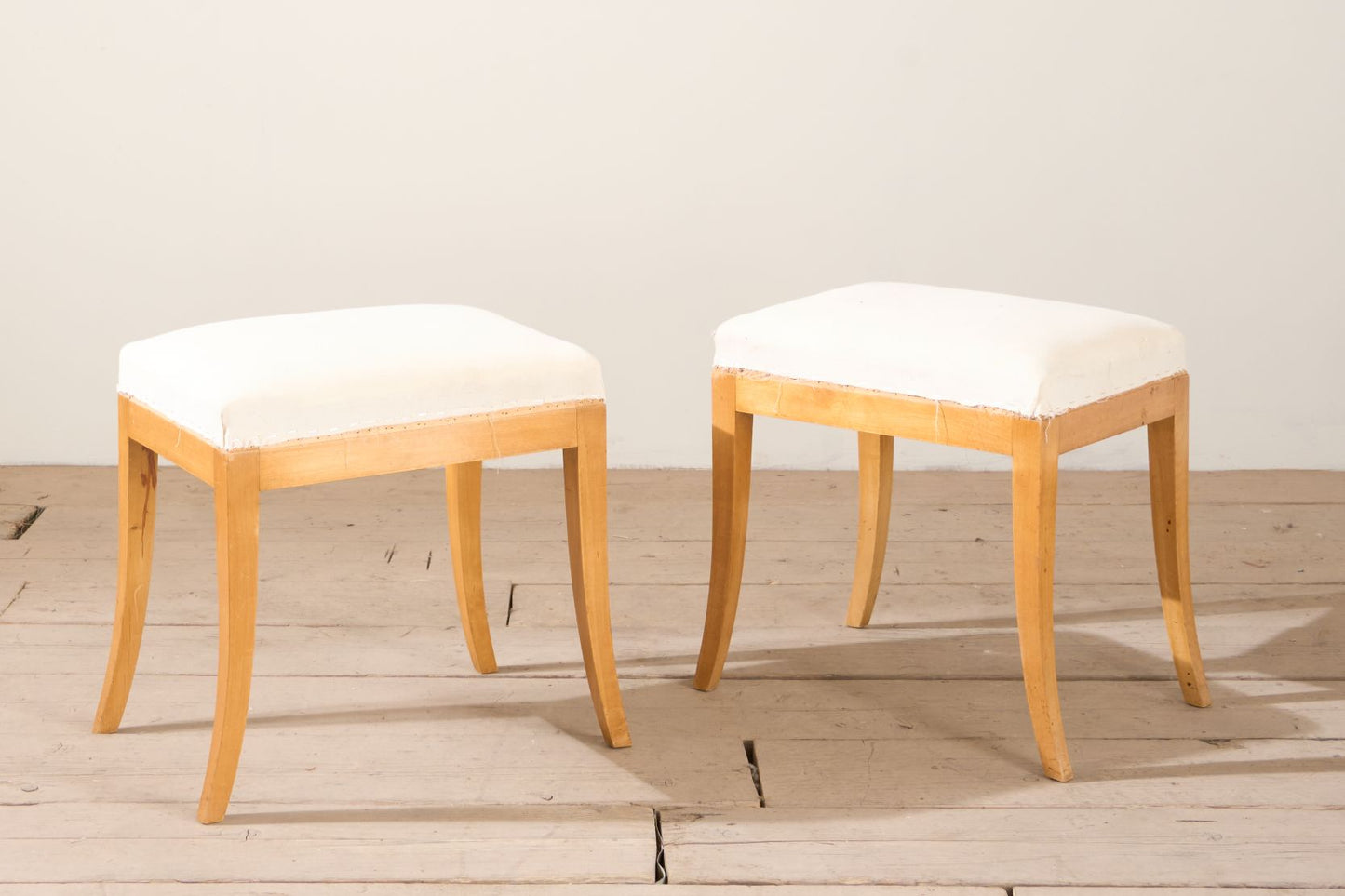 Early 20th century pair of Swedish satin birch stools