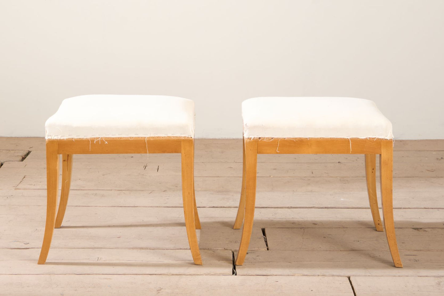 Early 20th century pair of Swedish satin birch stools