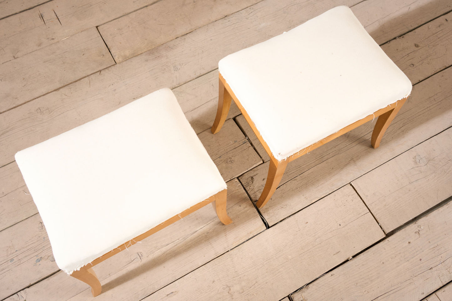 Early 20th century pair of Swedish satin birch stools