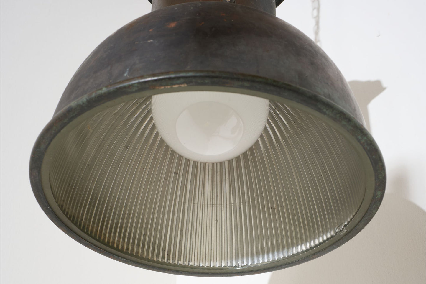 20th century patinated copper holophane pendant light
