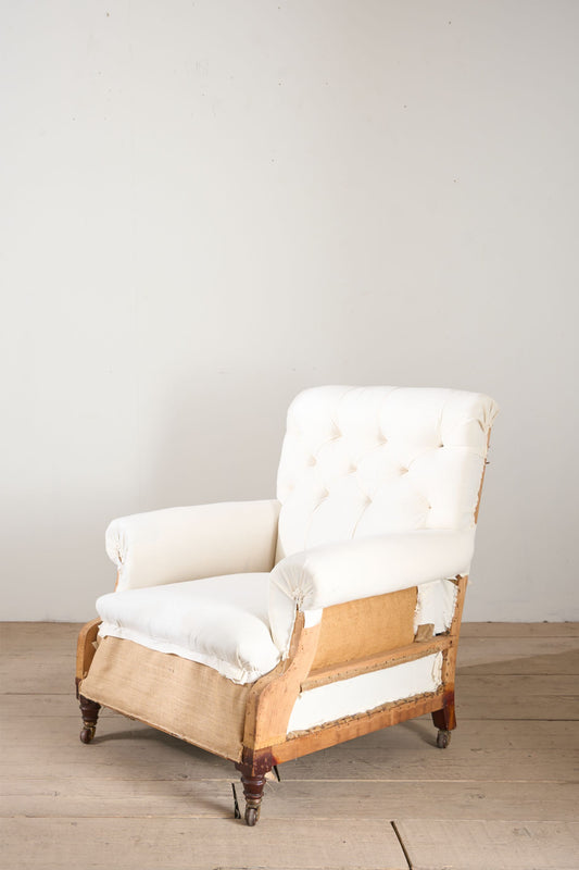 Large proportioned 19th century buttoned back armchair by Hamptons and sons