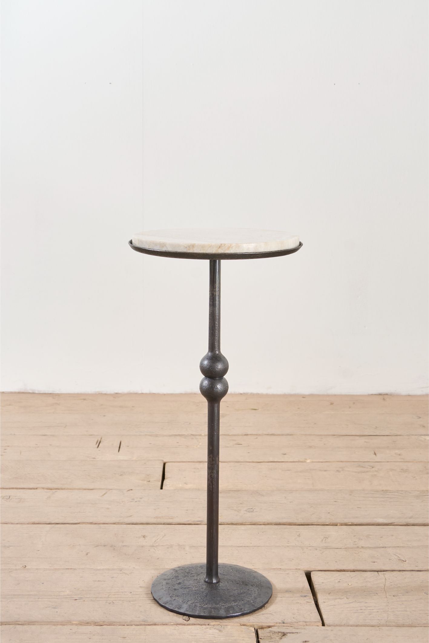 The 'Brokkr' forged steel martini table with quartzite top