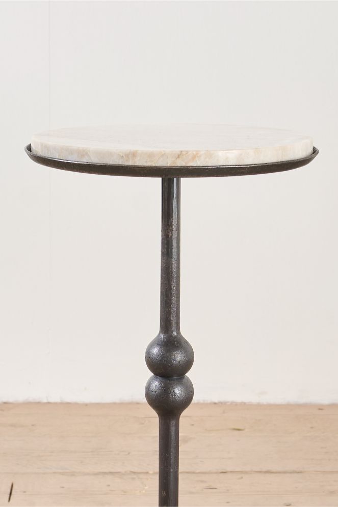 The 'Brokkr' forged steel martini table with quartzite top