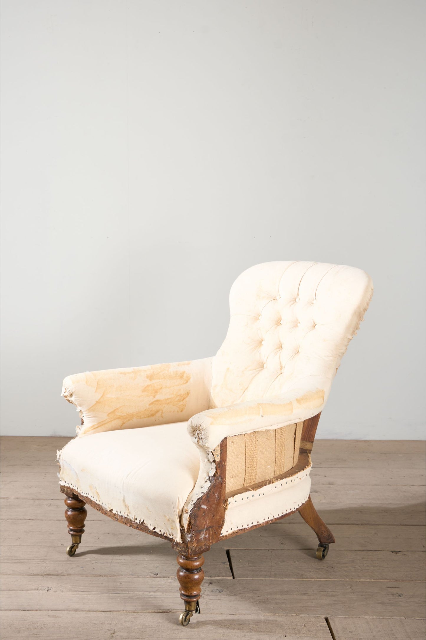 Early Victorian buttoned back country house armchair