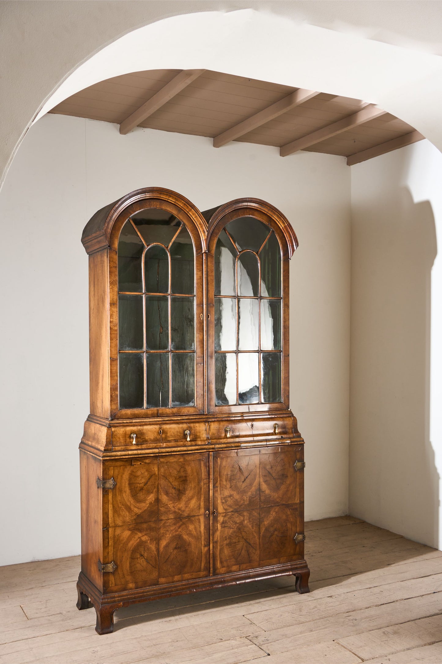 19th century George I style double arched walnut cabinet
