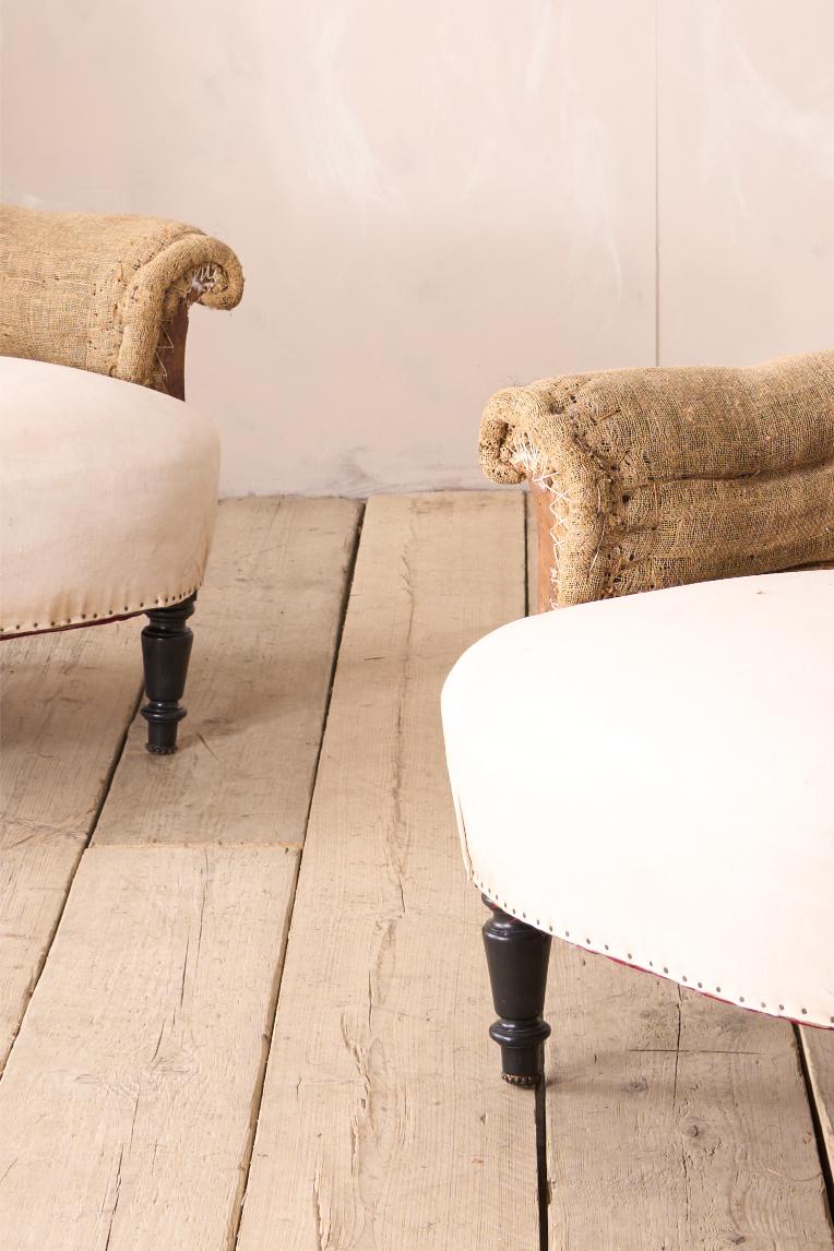 Pair of Napoleon III curved hessian back armchairs