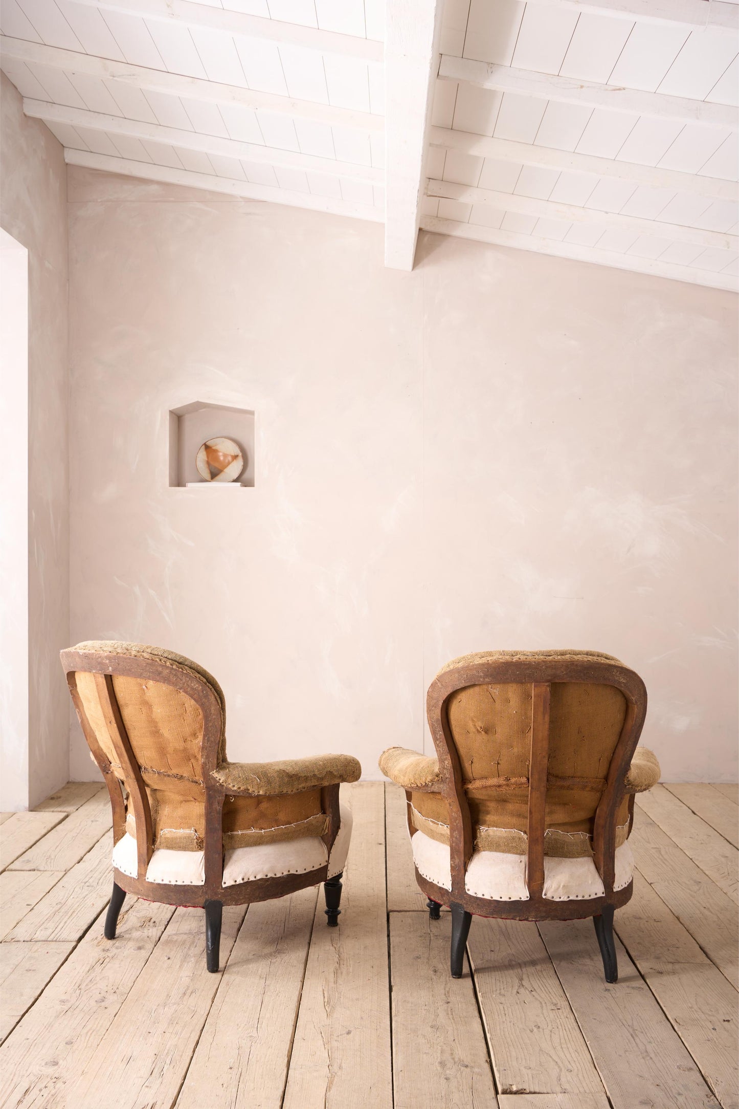 Pair of Napoleon III curved hessian back armchairs