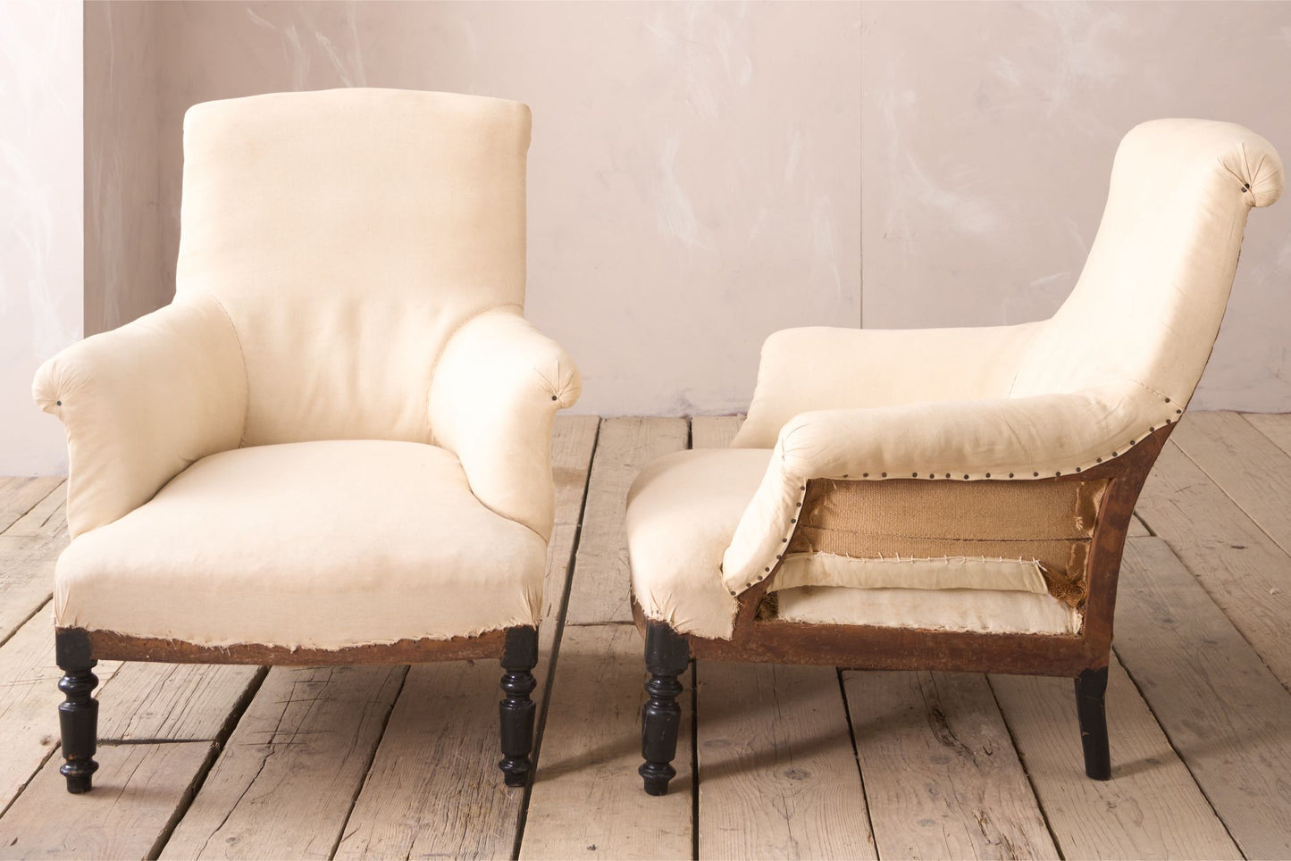 Pair of Napoleon III scroll back armchairs