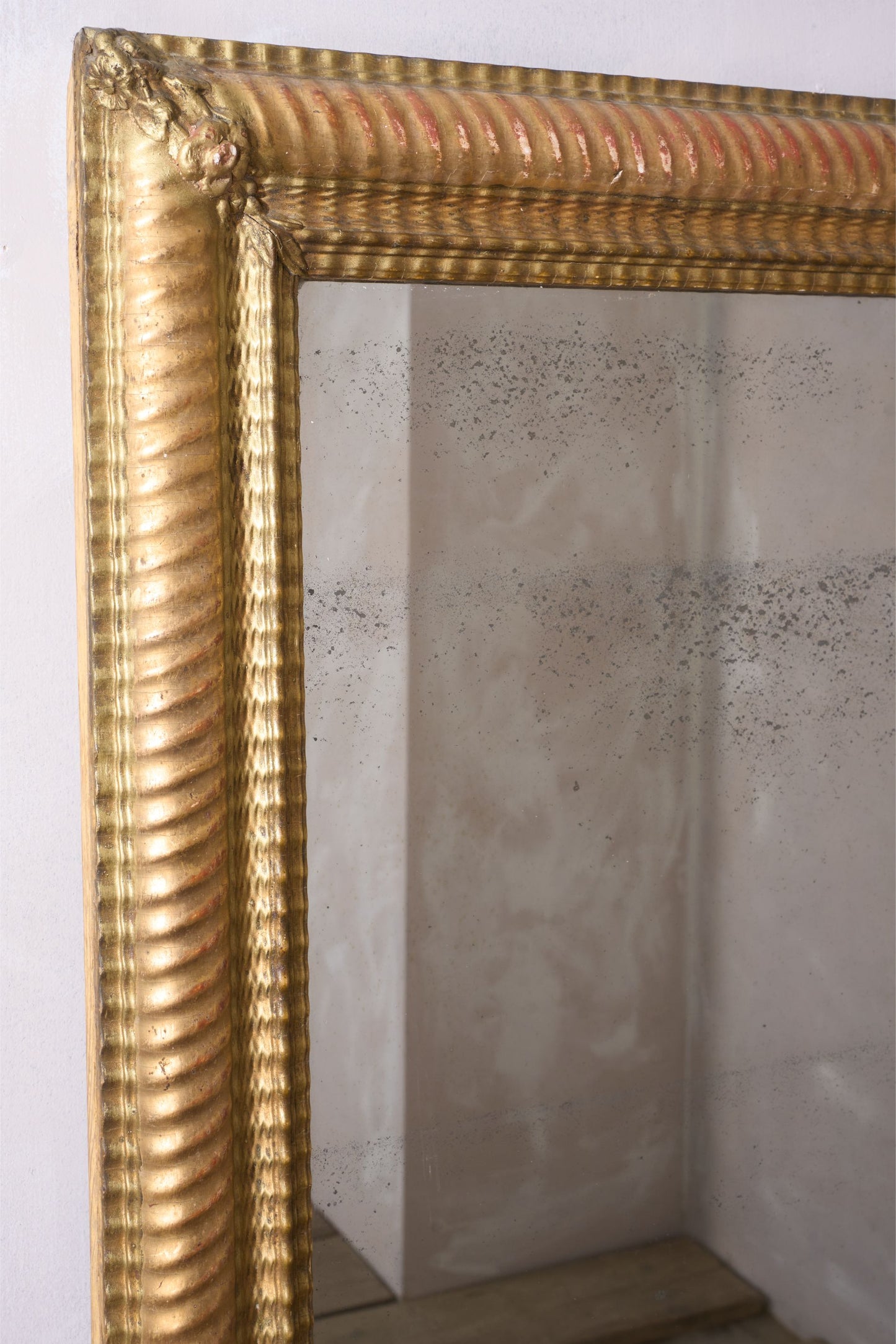 19th century Rippled gilt wall mirror