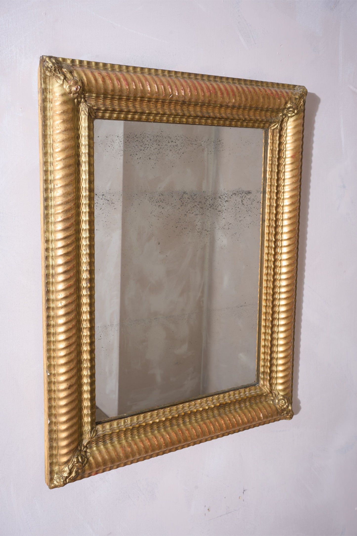 19th century Rippled gilt wall mirror
