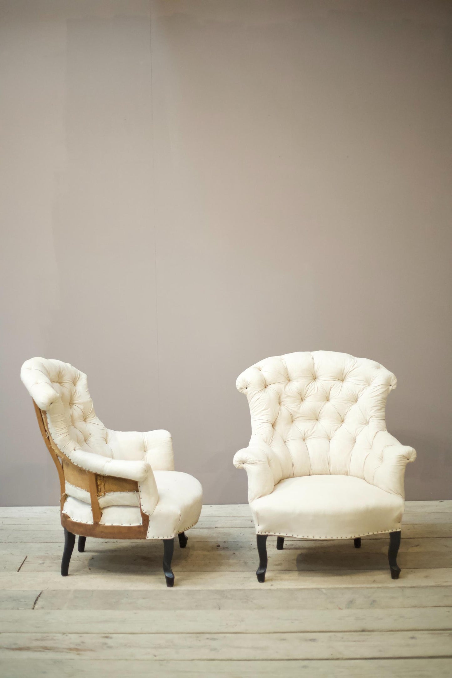 Pair of Napoleon III buttoned fishtail armchairs