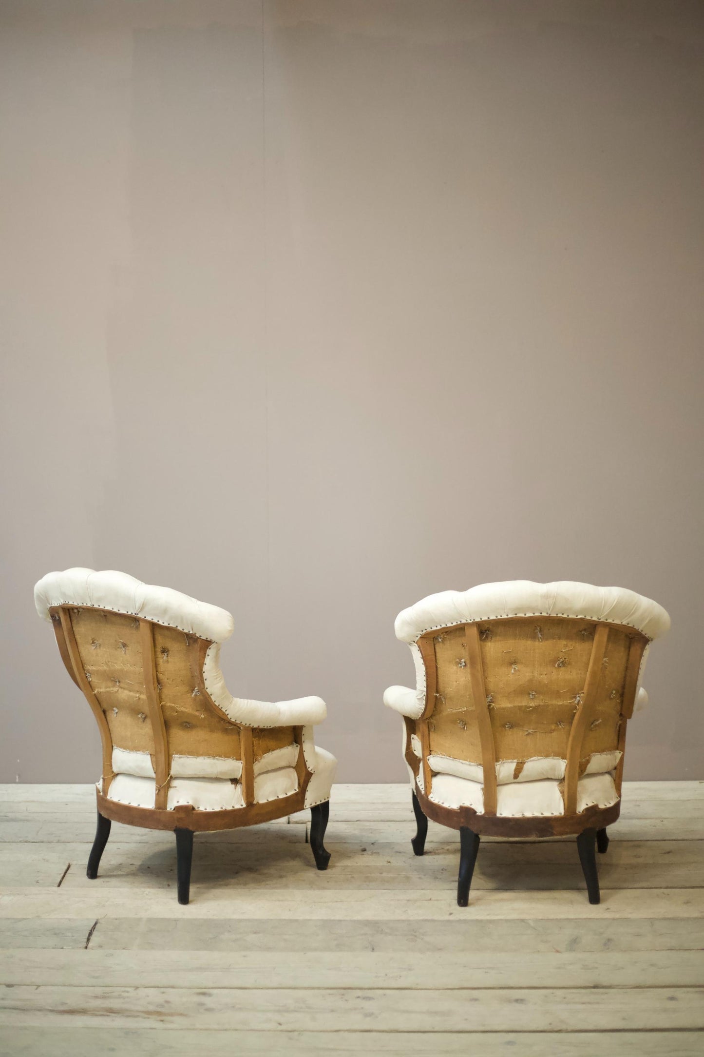 Pair of Napoleon III buttoned fishtail armchairs