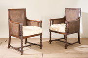 Pair of c.1920 barley twist mahogany rattan lounge chairs