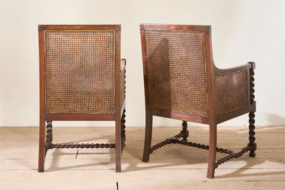 Pair of c.1920 barley twist mahogany rattan lounge chairs