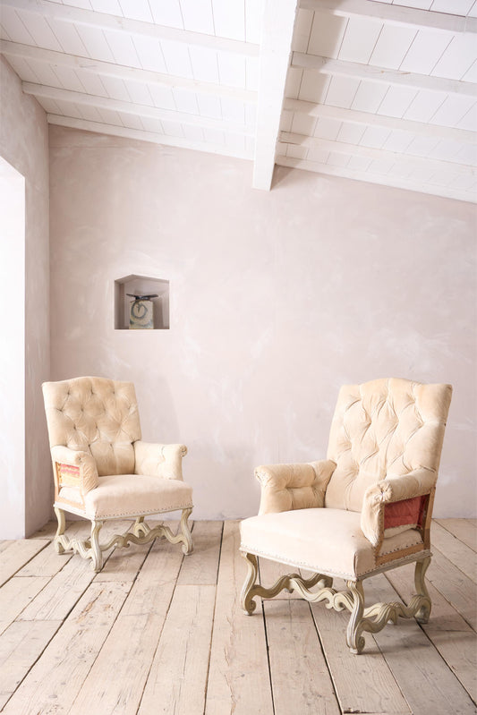 Pair of 19th century French buttoned back armchairs with painted carved frame