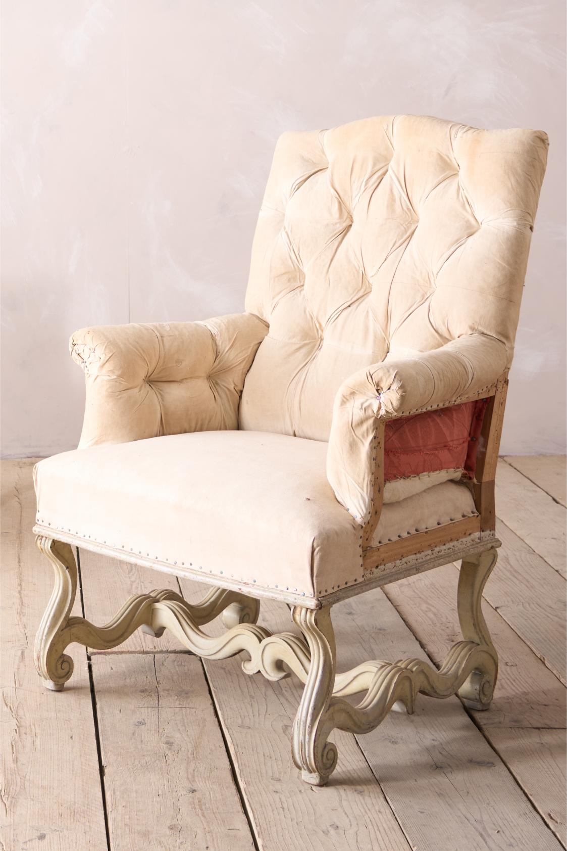 Pair of 19th century French buttoned back armchairs with painted carved frame