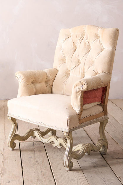 Pair of 19th century French buttoned back armchairs with painted carved frame