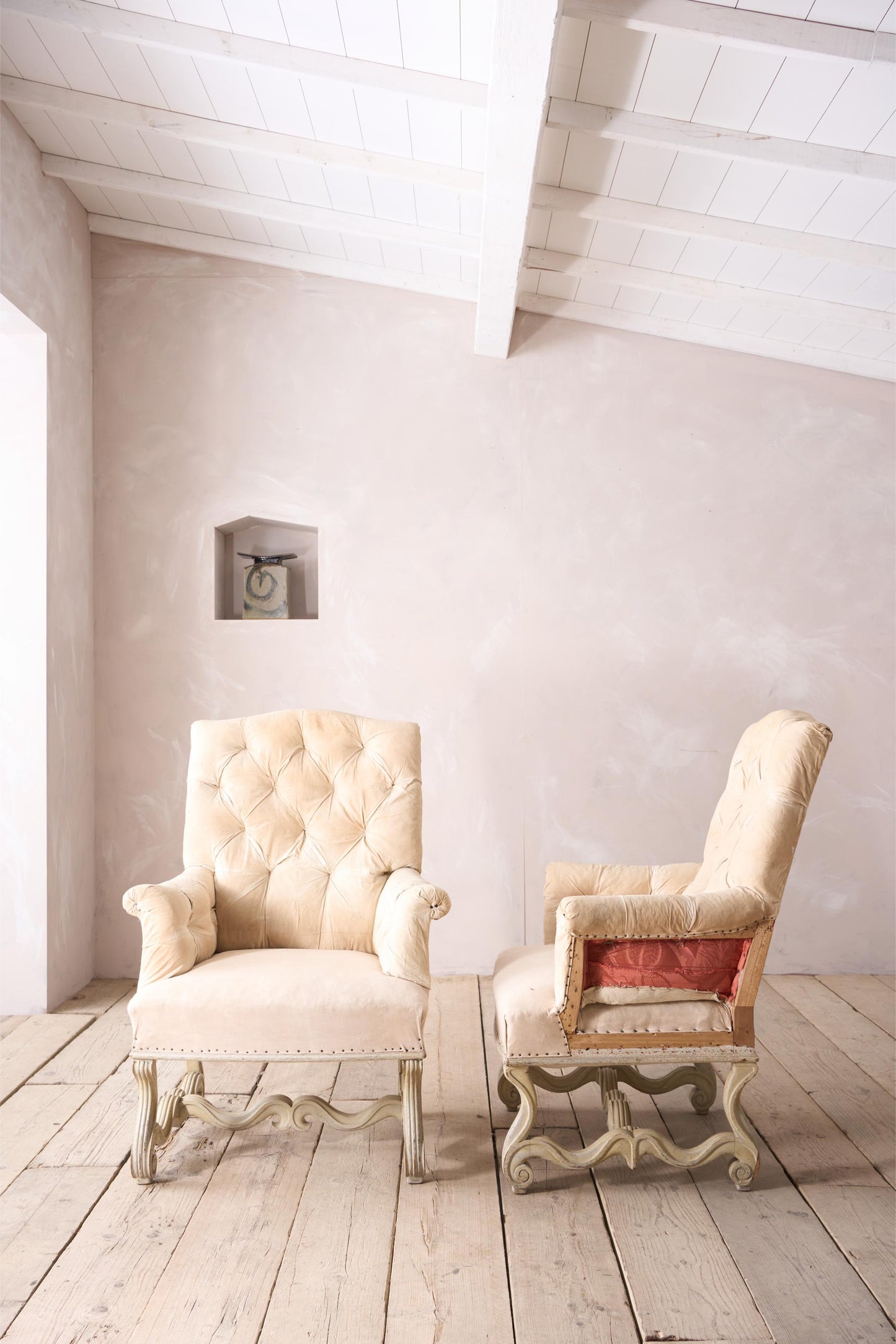 Pair of 19th century French buttoned back armchairs with painted carved frame
