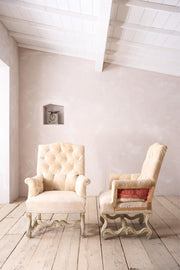 Pair of 19th century French buttoned back armchairs with painted carved frame