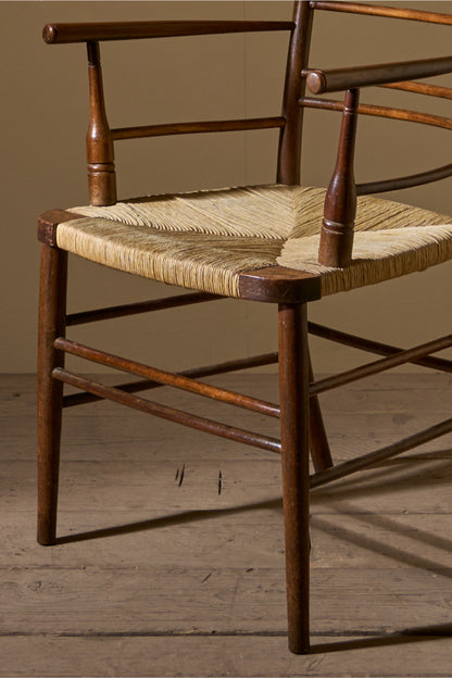 Arts & Crafts English oak and rush seat armchair