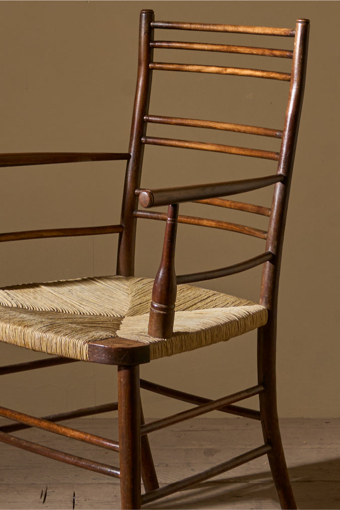 Arts & Crafts English oak and rush seat armchair