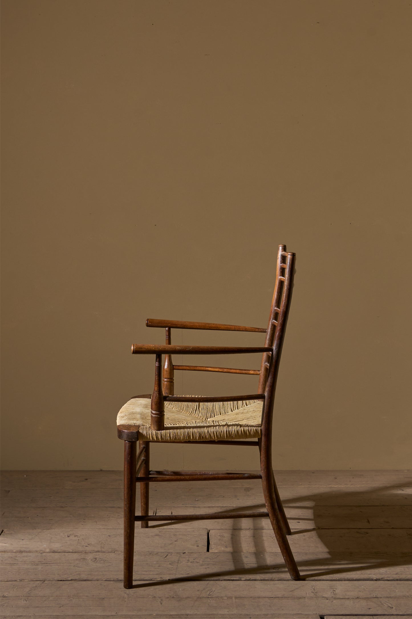 Arts & Crafts English oak and rush seat armchair