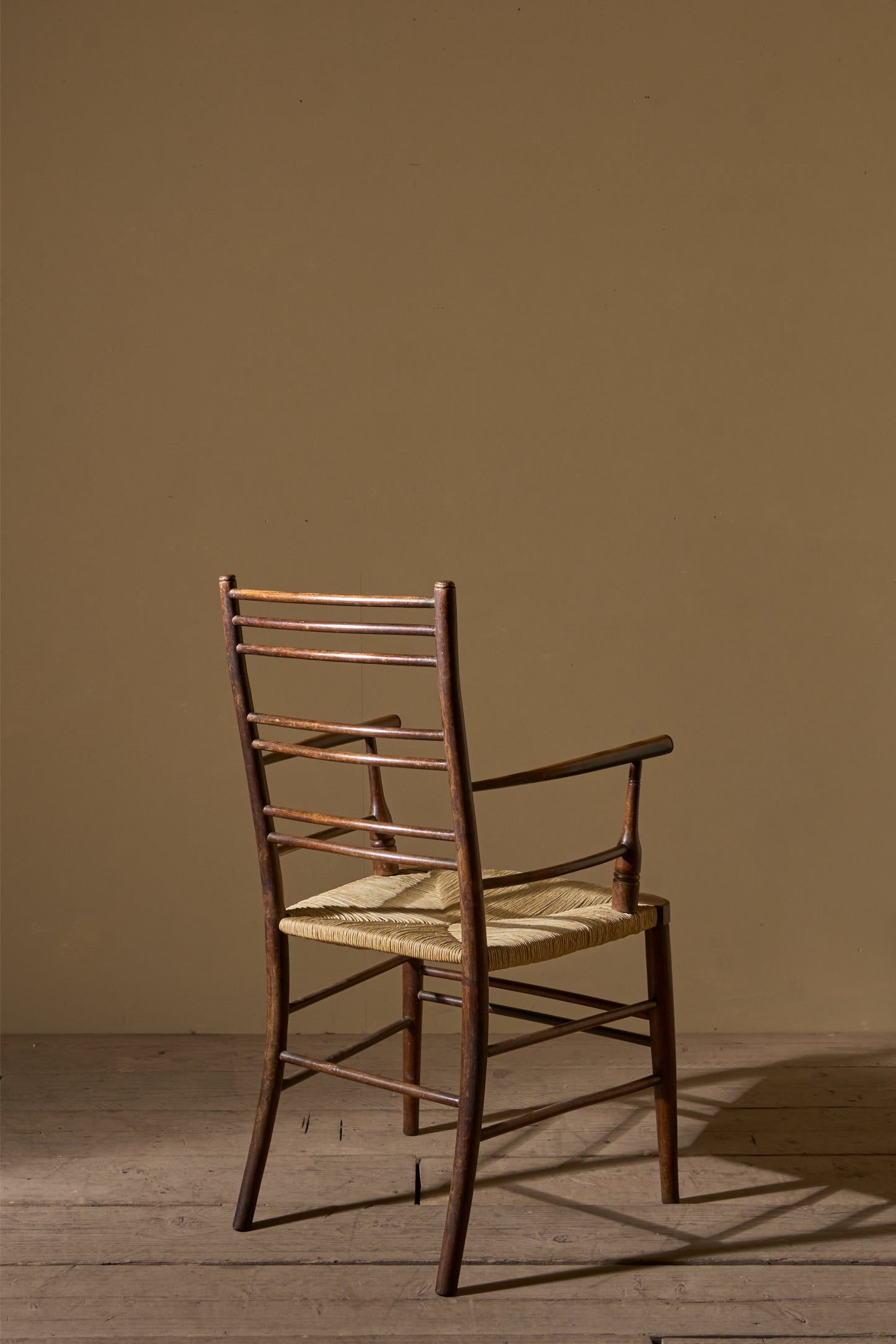 Arts & Crafts English oak and rush seat armchair