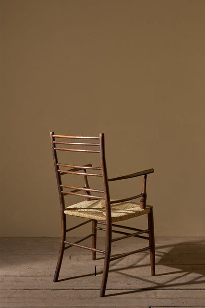 Arts & Crafts English oak and rush seat armchair