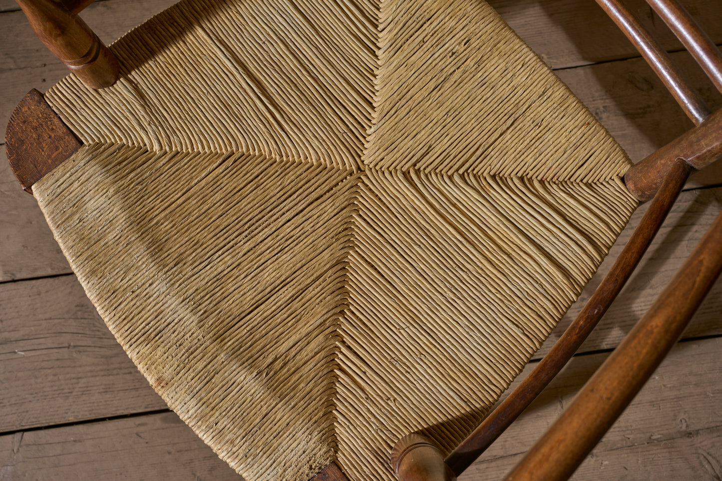 Arts & Crafts English oak and rush seat armchair